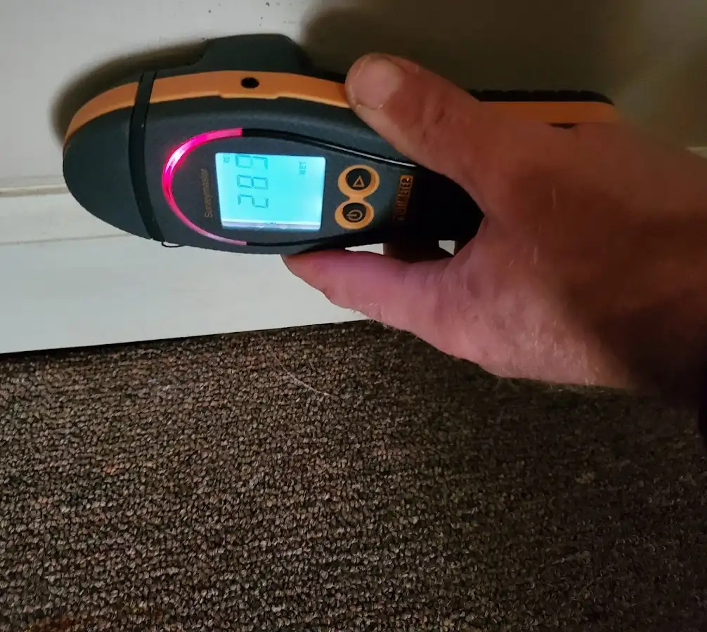 Moisture detection at baseboard during Storm Damage Restoration in Centerville